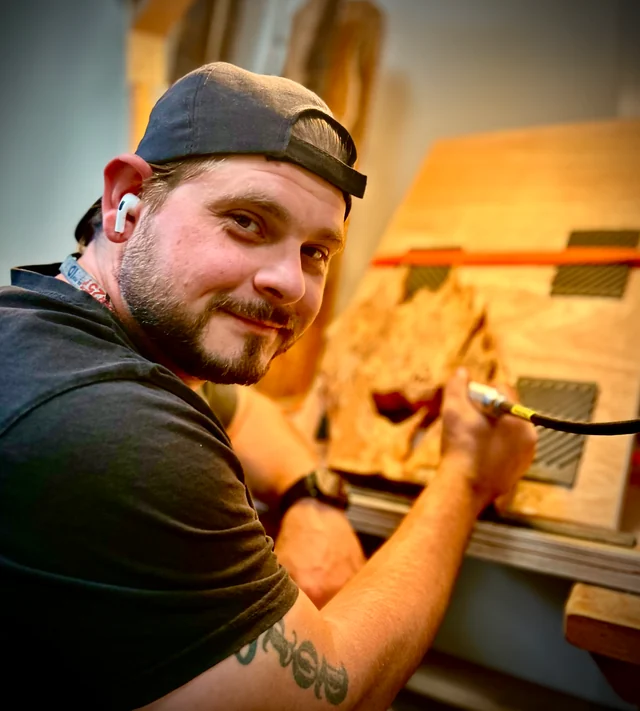 Sam carving in The Timedrop Atelier workshop